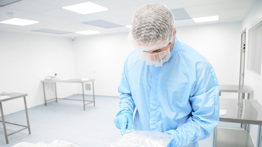 Photo of person wearing cleanroom PPE in a cleanroom - Integrity Cleanroom